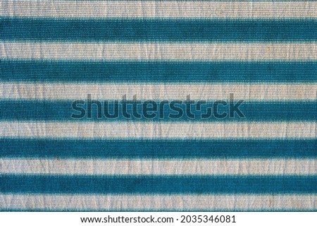 Background from striped fabric of gray-birch color.