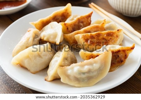 Gyoza, pot sticker, pan-fried dumpling Royalty-Free Stock Photo #2035362929