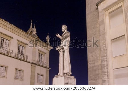statue under a starry sky near a university in portugal - photo taken at the blue hour at coimbra - ancient statue - demosthenes