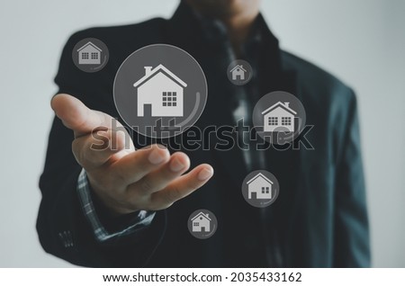 Buying, selling and renting houses or real estate concept, property online, Businessman hands on a virtual screen concept.