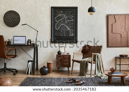 Creative composition of elegant masculine living room interior with mock up poster frame, brown armchair, industrial office desk and personal accessories. Template. Royalty-Free Stock Photo #2035467182