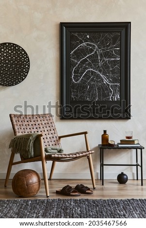 Creative composition of elegant masculine living room interior with mock up poster frame, brown armchair, industrial shelf and personal accessories. Template.  