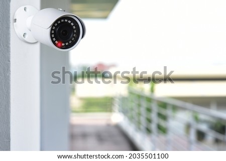 CCTV camera install by have water proof cover to protect camera with home security system concept. Royalty-Free Stock Photo #2035501100
