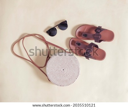 The round bag made of rattan is very environmentally friendly. Rattan bag with a simple and elegant motif is perfect for everyday use. Women's sling bag. Free space for ads. Bag mockup. Focus blur.