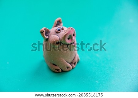 Macro shot of a little cheerful toy pig