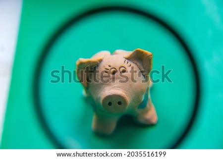 Macro shot of a little cheerful toy pig