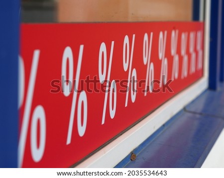 red color sale sign percent discounts on storefront
