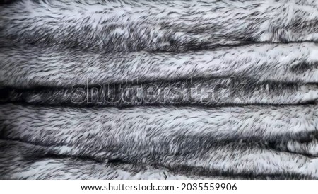 Gray wolf artificial fur background texture for design, black and white fake animal fell