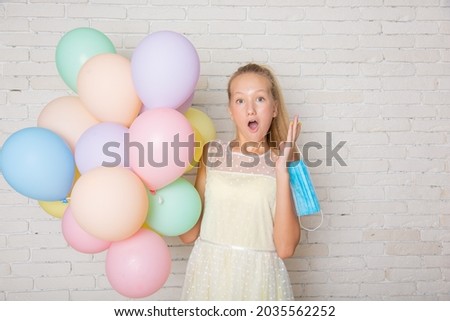 teenage girl with balloons at home