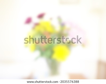 Soft blurry background in mainly yellow on white from a blurry photo with copy space 