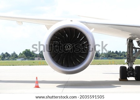 Turbofan engine under the wing of modern jetliner Royalty-Free Stock Photo #2035591505