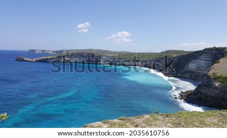 Cove of rocks by the sea  in Lombok Indonesia. with blue sky back ground and blue ocean wave show the beautiful scenery