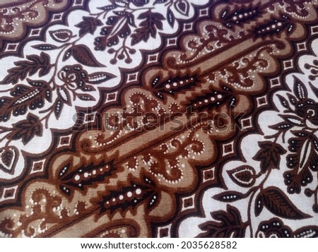 handmade batik cloth with floral motifs made by Indonesian craftsmen