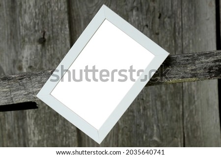 white blank wooden frame with grey plank wall background