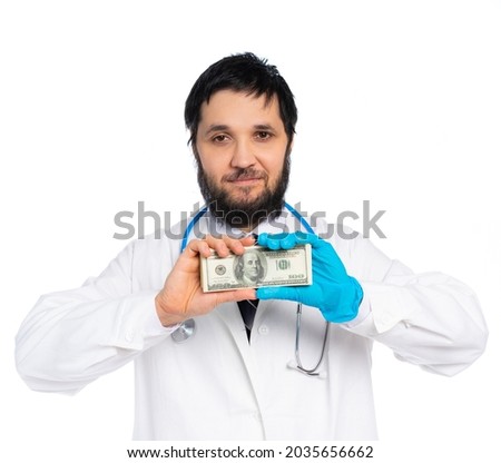 portrait of a doctor. a medical worker in a white coat is holding money in front of him, dollars. corruption in medicine. paid services. isolated white background