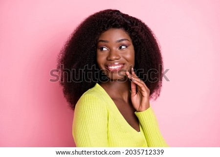 Profile photo of adorable dark skin girl fingers touch cheek look empty space isolate don pink color background