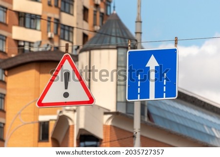Street signs in the city against the sky.