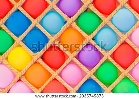 Bright colored air balloons background for play darts.