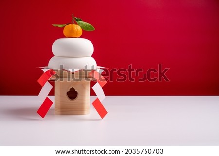 KAGAMIMOCHI is offering to God.
A round rice cake means harmony.Have a wish for a harmonious age.
Red and White Background. Royalty-Free Stock Photo #2035750703