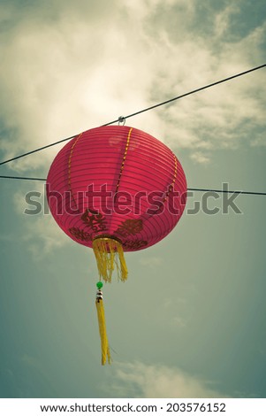 Red Chinese Paper Lanterns against a Blue Sky. Vertical shot