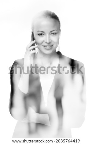 Portrait of beautiful young caucasian woman using mobile phone.