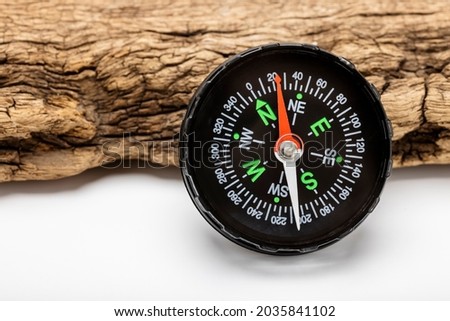 Vintage compass, navigational compass on wooden background 