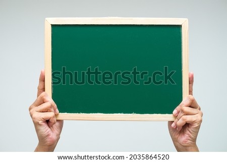 Isolated small blackboard with fingers,hands