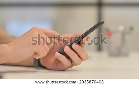Close up of Male Hands Typing on Tablet 