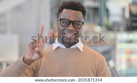 African Man showing Victory Sign 