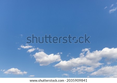 Beautiful cloudy sunny blue sky, with white high clouds.