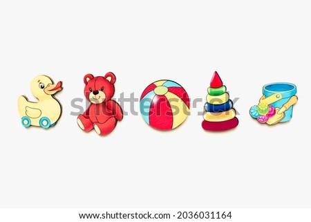 Children's puzzles made of wood. Childrens toys made of wood on a white background. Children's pictures. 