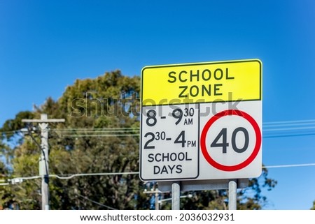 School zone road sign with speed limit 40 during before and after school hours in NSW, Australia. Road safety concept