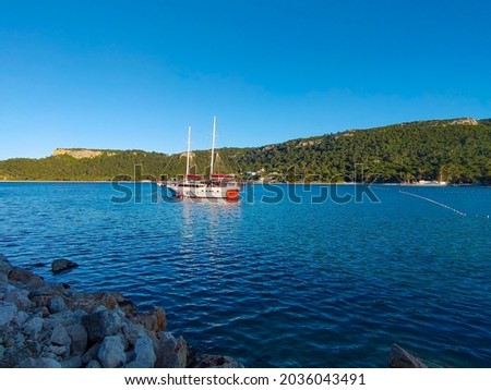 Summer vacations - blue Mediterranean sea and Moonlight park sand beach resort at Turkey Kemer Royalty-Free Stock Photo #2036043491