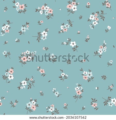 Vector seamless pattern. Pretty pattern in small flowers. Small colorful pastel flowers. Pale blue background. Ditsy floral background. The elegant the template for fashion prints. Stock vector. Royalty-Free Stock Photo #2036107562