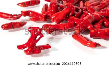 Shiny different natural  red corals close up on a white background.  Isolated jewelry with reflection. Royalty-Free Stock Photo #2036110808