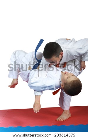 Boy with orange belt is doing throw judo Royalty-Free Stock Photo #203614375