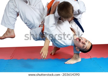 Sportsman with a blue belt doing judo throw Royalty-Free Stock Photo #203614390