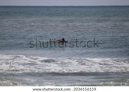 a girl swimming in the sea