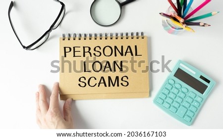 Financial concept meaning Personal Loan Scams with phrase on the piece of paper.