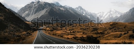 Beautiful view of a road leading to Mount Cook, New Zealand banner Royalty-Free Stock Photo #2036230238