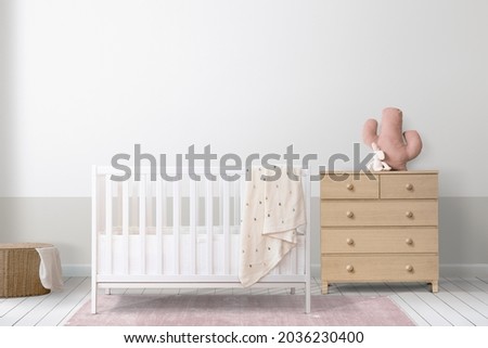 White crib in a minimal nursery room Royalty-Free Stock Photo #2036230400