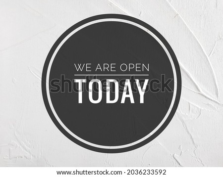 

Business concept with word "We are open today" on blurred background
.