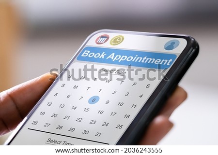 Booking Meeting Calendar Appointment On Mobile Phone Royalty-Free Stock Photo #2036243555