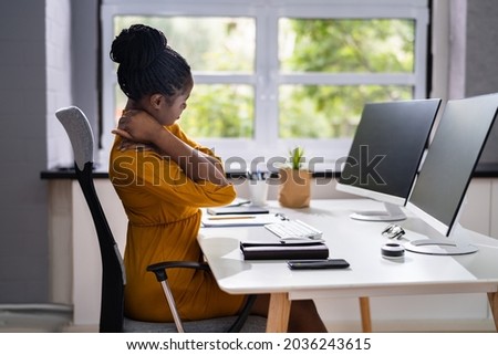 Ergonomic Chair And Posture Behind Workstation Computer. Shoulder Pain Royalty-Free Stock Photo #2036243615