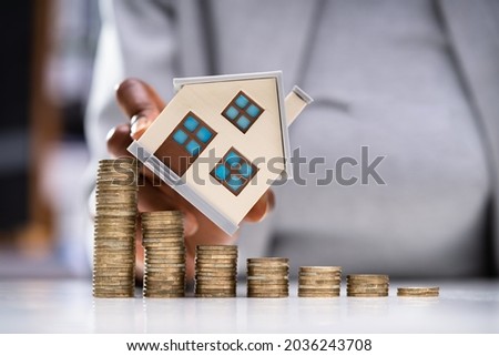 Real Estate Property Value Decrease And Price Fall Royalty-Free Stock Photo #2036243708