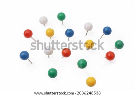 Colorful push pin thumbtack paper clip office business supplies isolated on white Royalty-Free Stock Photo #2036248538