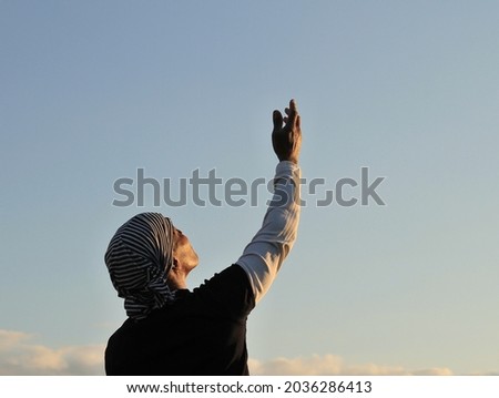 man praying with sky background stock photo