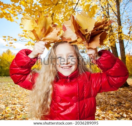 Autumn girl Portrait In Fall Yellow Leaves, Beautiful child in Park Outdoor, Knitted Clothing for October Season