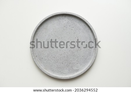 Empty ceramic plate, gray round tray plate isolated on white background with clipping path Royalty-Free Stock Photo #2036294552