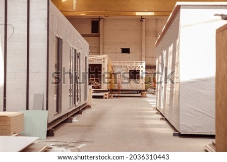 Prefabricated container houses in building under construction Royalty-Free Stock Photo #2036310443